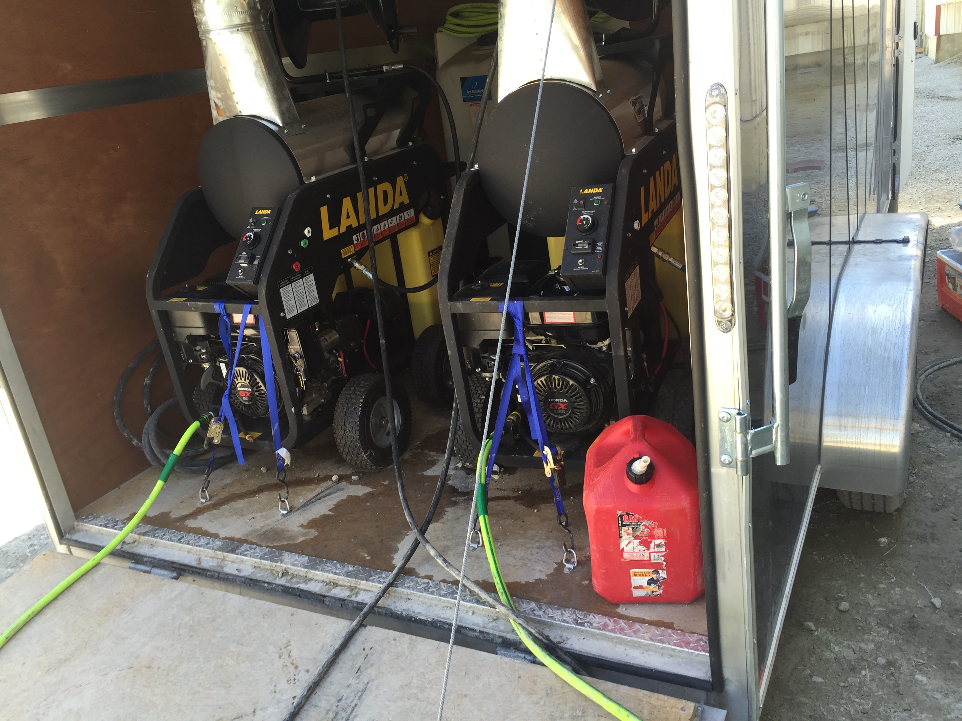 Landa commercial pressure washers inside cleaning trailer